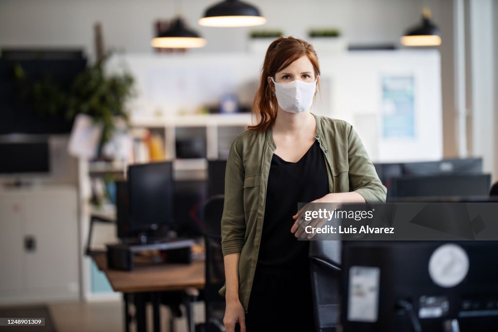 Businesswoman back to work at office after pandemic lockdown