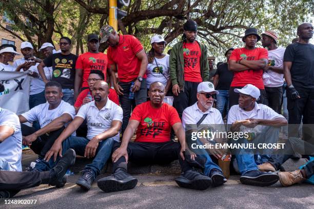 Economic Freedom Fighters leader Julius Malema along Expelled African National Congress member Carl Niehaus rest during march to the presidential...