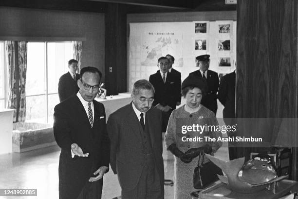 Emperor Hirohito and Empress Nagako watch local specialities on April 20, 1966 in Saijo, Ehime, Japan.