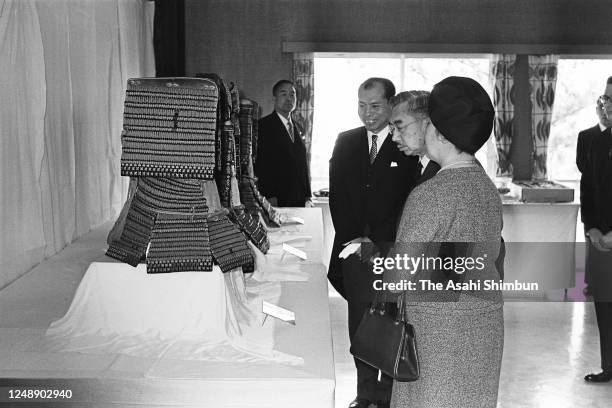 Emperor Hirohito and Empress Nagako watch local specialities and crafts on April 20, 1966 in Saijo, Ehime, Japan.