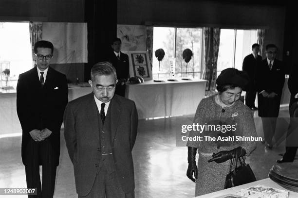 Emperor Hirohito and Empress Nagako watch local specialities on April 20, 1966 in Saijo, Ehime, Japan.