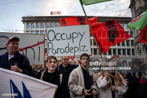 Member of Young Socialists Switzerland party stage a demonstration in front of the headquarters of Credit Suisse bank and next to a UBS offices on...