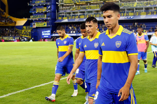 Alan Varela of Boca Juniors, Frank Fabra of Boca Juniors, Miguel Merentiel of Boca Juniors and Guillermo Fernandez of Boca Juniors leave the field at...