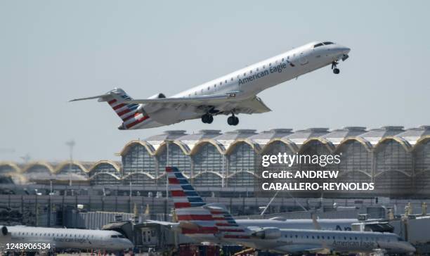 Regional American Airlines plane takes off from Ronald Reagan Washington National Airport in Arlington, Virginia on March 20, 2023. The world will...