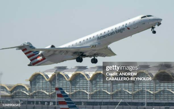 Regional American Airlines plane takes off from Ronald Reagan Washington National Airport in Arlington, Virginia on March 20, 2023. The world will...