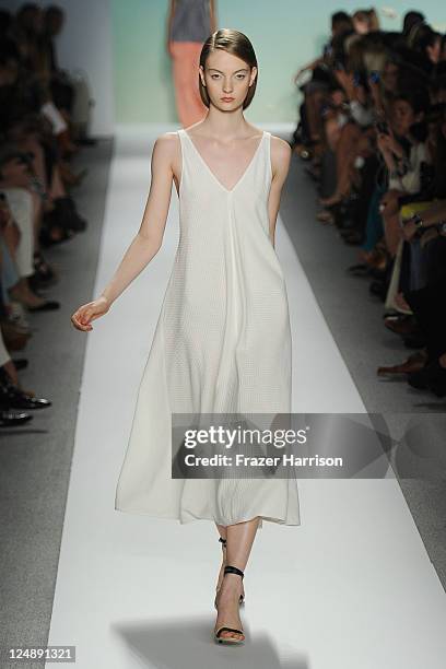 Model walks the runway at the Tibi Spring 2012 fashion show during Mercedes-Benz Fashion Week at The Stage at Lincoln Center on September 13, 2011 in...