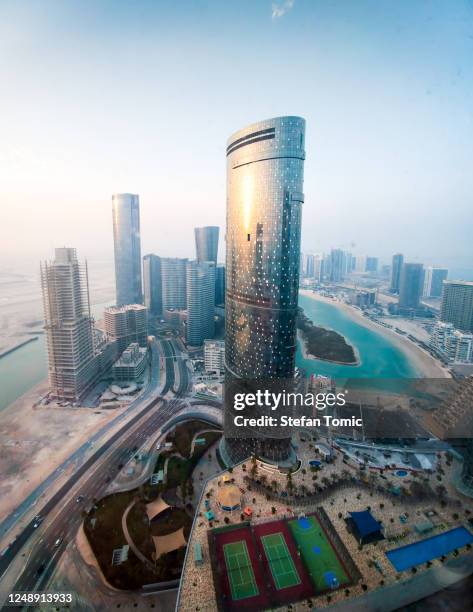 skyline of al reem island in abu dhabi, united arab emirates - gateway towers building stock pictures, royalty-free photos & images
