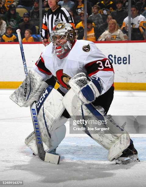 Dylan Ferguson of the Ottawa Senators defends the net during the first period against the Pittsburgh Penguins at PPG PAINTS Arena on March 20, 2023...