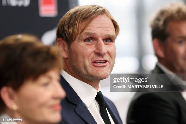Scott Robertson (C new New Zealand rugby coach with Mark Robinson NZ Rugby CEO (R and Dame Patsy Reddy Chair of NZ Rugby speaks to media during a...