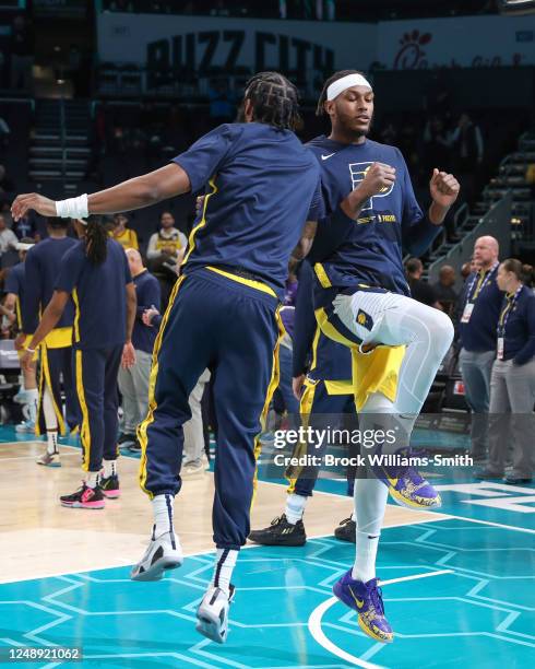 Oshae Brissett and Myles Turner of the Indiana Pacers during the player indroduction on March 20, 2023 at Spectrum Center in Charlotte, North...