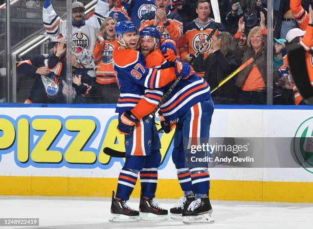 Mattias Ekholm of the Edmonton Oilers celebrates his second goal of the game in the third period against the San Jose Sharks with Connor McDavid on...