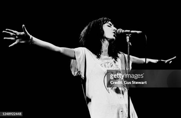 Patti Smith performs on stage at The Rainbow Theatre, London, England, on April 2 1978.