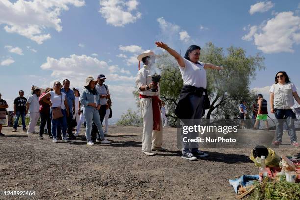 Person performs a pre-Hispanic ritual for inhabitants of Mexico City who visited the Cerro de la Estrella archaeological site in the Iztapalapa...