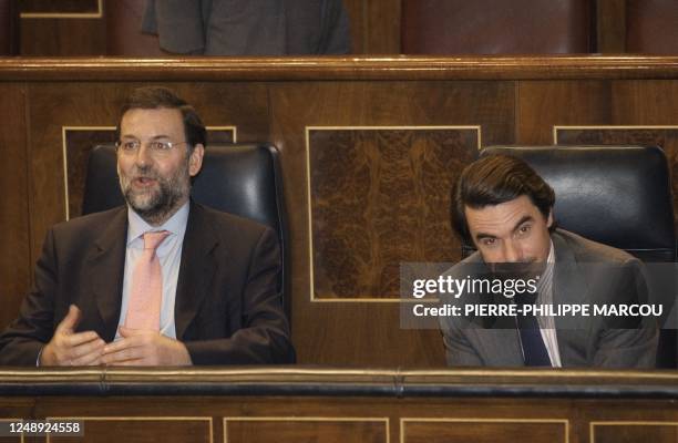 Spanish Prime Minister Jose Maria Aznar and Vice Prime Minister Mariano Rajoy react as they know the positive result of the vote against a peaceful...