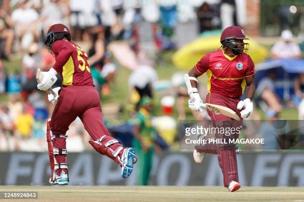 West Indies' Brandon King and West Indies' Kyle Mayers run between the wickets during the third one-day international cricket match between South...