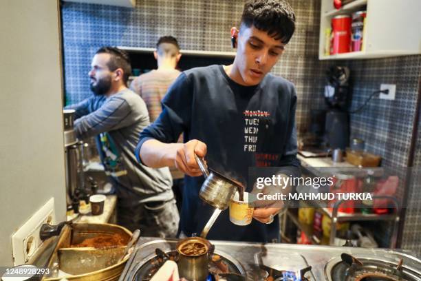 In this picture taken on March 16 a barista prepares coffee at a cafe in Tripoli. - Italy left a deep cultural mark on Libya, the only Arab country...