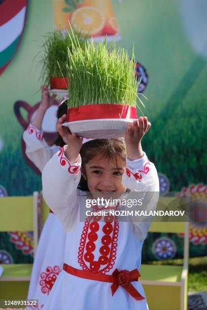 Tajiks participate in Nowruz celebrations in Dushanbe on March 21, 2023. - Nowruz, "The New Year" in Farsi, is an ancient festival marking the first...