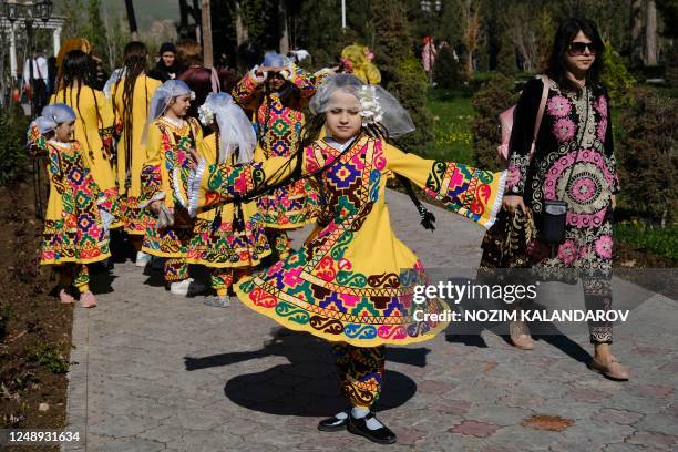 Tajiks participate in Nowruz celebrations in Dushanbe on March 21, 2023. - Nowruz, "The New Year" in Farsi, is an ancient festival marking the first...