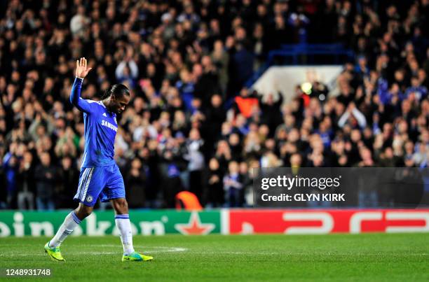 Chelsea's Ivorian forward Didier Drogba acknowledges the crowd at the end of the UEFA Champions League group E football match against Valencia at...