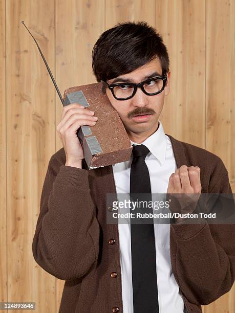 businessman using brick mobile phone in office - brick phone stock pictures, royalty-free photos & images