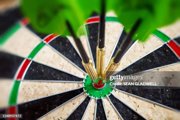 close up darts in bullseye - triple stock pictures, royalty-free photos & images