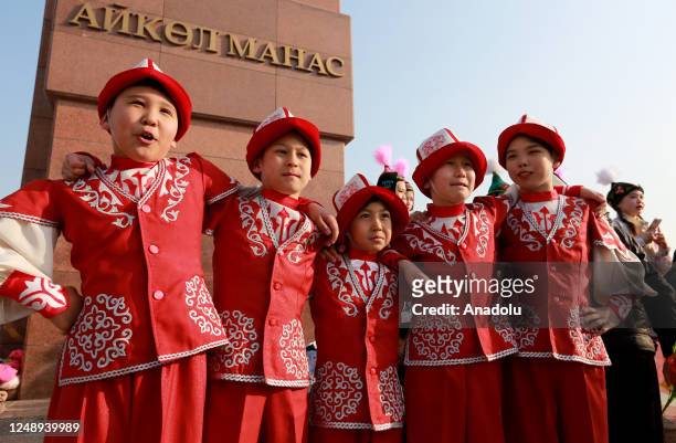 People celebrate Nowruz, considered as the harbinger of spring, awakening of nature and brotherhood, with traditional costumes at Ala-Too square in...