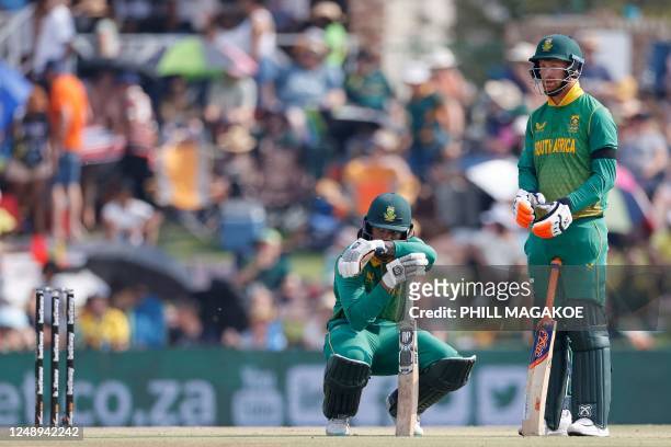 South Africa's Tony de Zorzi and South Africa's Heinrich Klaasen watch the screen while waiting for a decision on de Zorzi's dismissal during the...