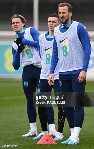 England's midfielder Conor Gallagher , England's midfielder Phil Foden and England's striker Harry Kane attend a team training session at St George's...