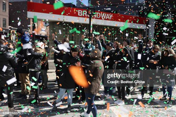 Boston, MA Confetti flies at the start of the 2023 St. Patrick's Day Parade.