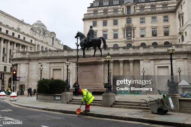 Street sweeper outside the Bank of England headquarters in the City of London, UK, on Tuesday, March 21, 2023. The central bank is due to release its...