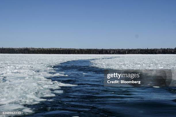 Path of cleared ice on the frozen waters of St. Mary's River following US Coast Guard Cutter 'Katmai Bay' operations in Sault Sainte Marie, Michigan,...