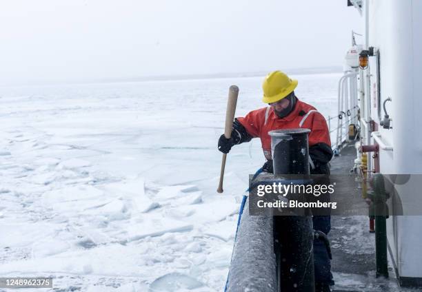 Crew member of the US Coast Guard 'Katmai Bay' Cutter ship during ice clearing operations on St. Mary's River in Sault Sainte Marie, Michigan, US, on...