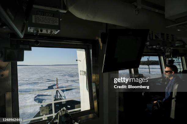 Crew member of the US Coast Guard 'Katmai Bay' Cutter ship during ice clearing operations on St. Mary's River in Sault Sainte Marie, Michigan, US, on...