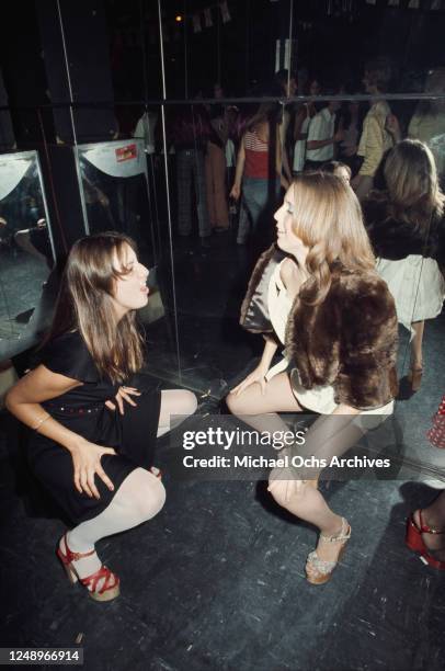 Two young women dancing at Rodney Bingenheimer's English Disco in Los Angeles, USA, circa 1974.