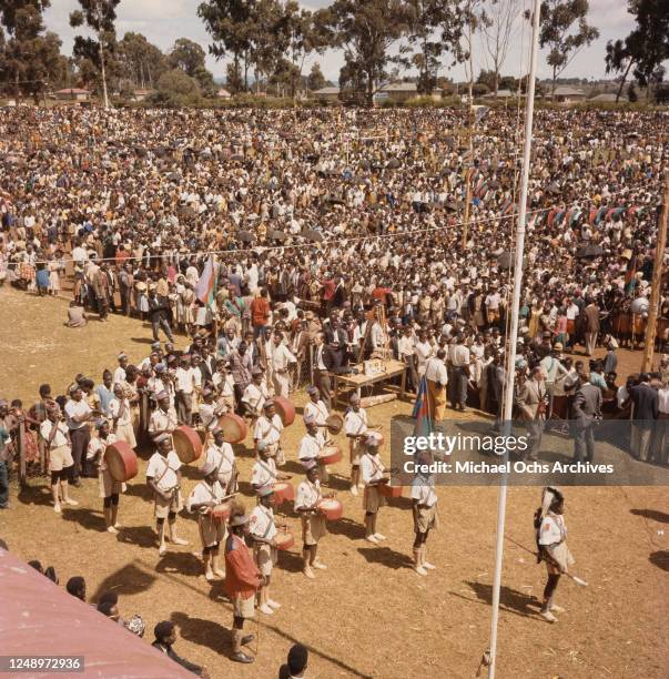 Kikuyu people gather in the Ruring'u Stadium in Nyeri, Kenya, as a symbolic gesture of surrender after the Mau Mau Uprising, 1963.