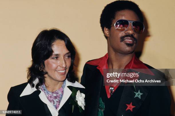 American singers Joan Baez and Stevie Wonder at the 18th Annual Grammy Awards in Hollywood, California, 28th February 1976.