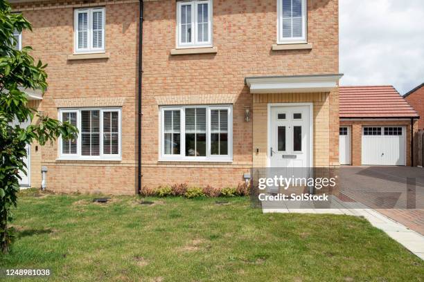 parcel at the door - front door stock pictures, royalty-free photos & images