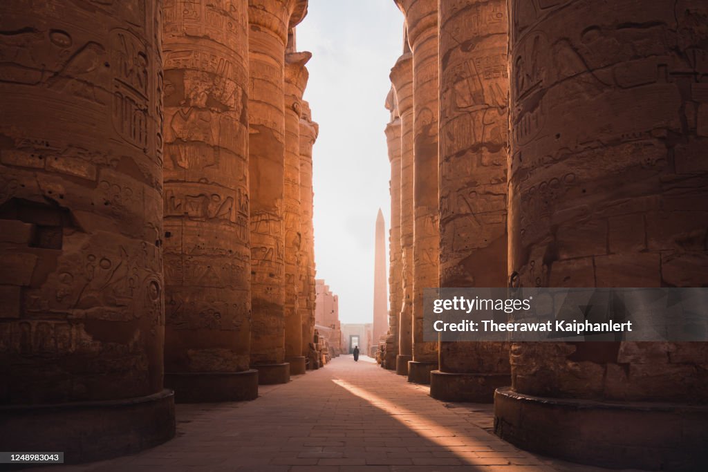 Ancient corridor and columns of Karnak temple complex in Luxor city Egpyt during sunrise