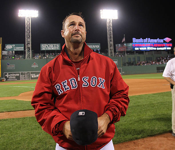 Tim Wakefield of the Boston Red Sox reacts after earning his 200th win after a game with the Toronto Blue Jays at Fenway Park on September 13, 2011.