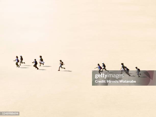 boys and girls running in the square - multiple same person stock pictures, royalty-free photos & images