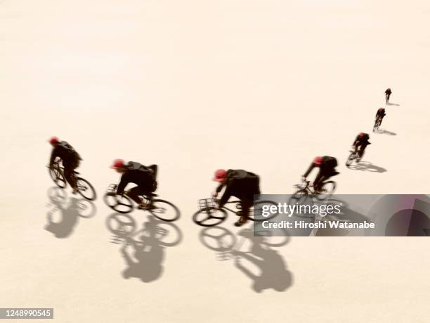 man riding a bicycle in the square - multiple same person stock pictures, royalty-free photos & images