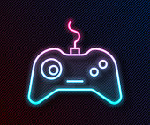 Glowing neon line Gamepad icon isolated on black background. Game controller. Vector Illustration