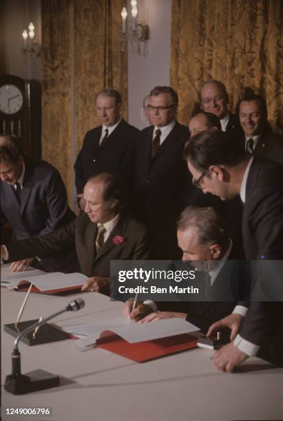 Canadian politician Pierre Trudeau and Russian politician Alexei Kosygin in the Kremlin signing Soviet-Canadian Protocol on Consultations on...