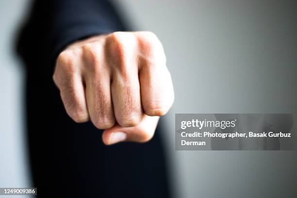 a man clenching fist - knuckle ストックフォトと画像