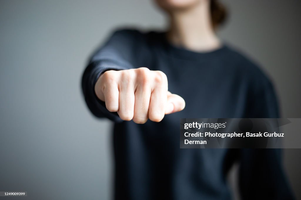 A woman clenching fist