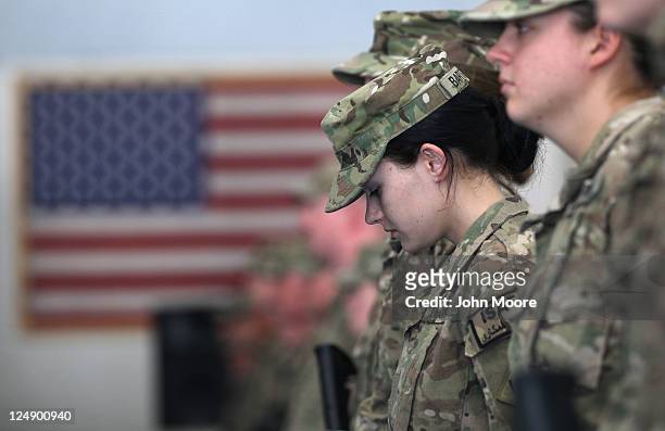 Oklahoma National Guard soldier PFC. Sarah Bartodei and fellow soldiers gather to receive their combat action patches on the anniversary of the...