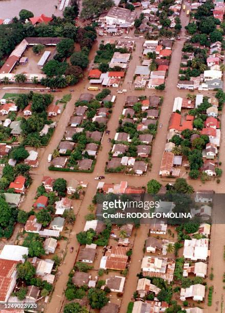 An aerial view shows the town of La Lima, Honduras, 260kms north of Tegucigalpa, 09 November where flood waters cover the streets. Some 30,000 people...