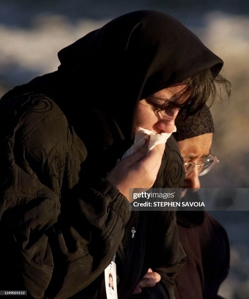 Flight 990 Family members of victims of the crash of EgyptAir Flight 990 weep as ...