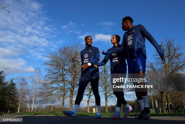 France's goalkeeper Mike Maignan, France's forward Kylian Mbappe and Fance's midfielder Aurelien Tchouameni arrive for a training session in...