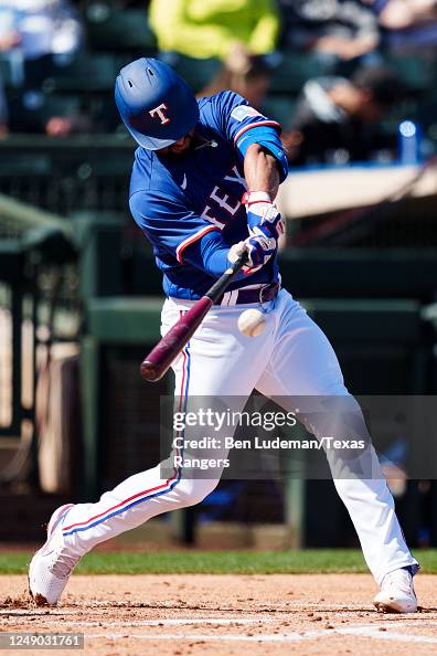 Marcus Semien of the Texas Rangers bats during a spring training game ...